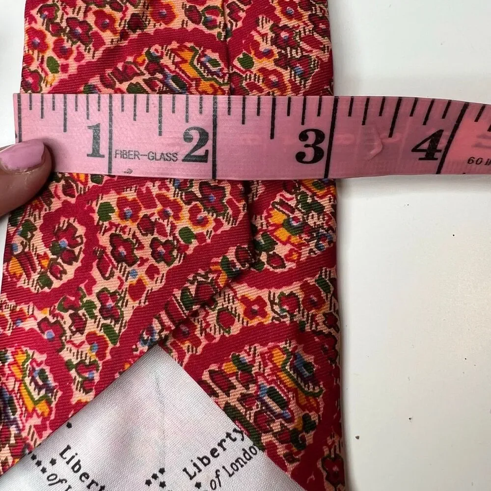 Liberty of London vintage red patterned silk necktie features a vibrant tie